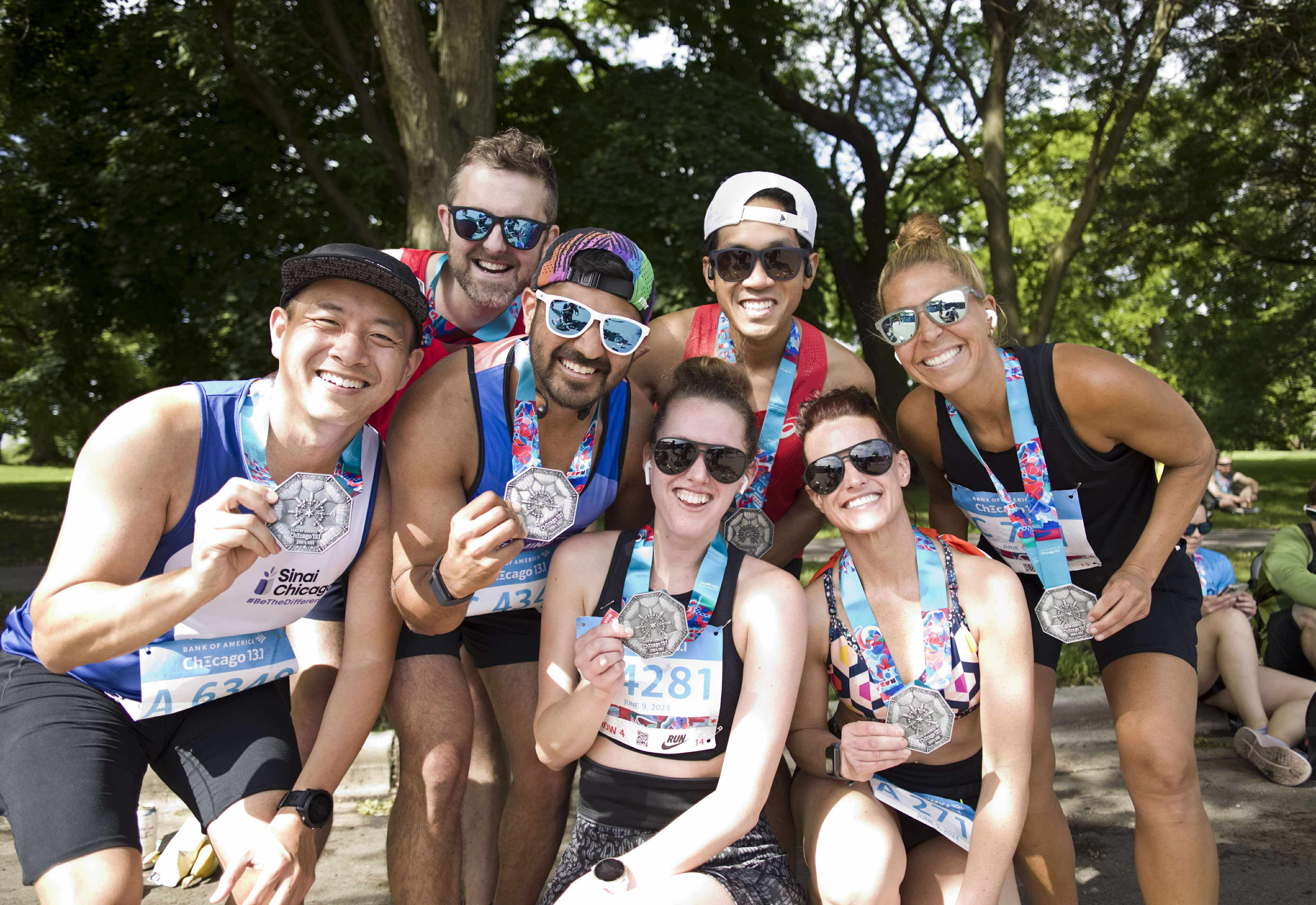 South Loop Runners celebrating with medals